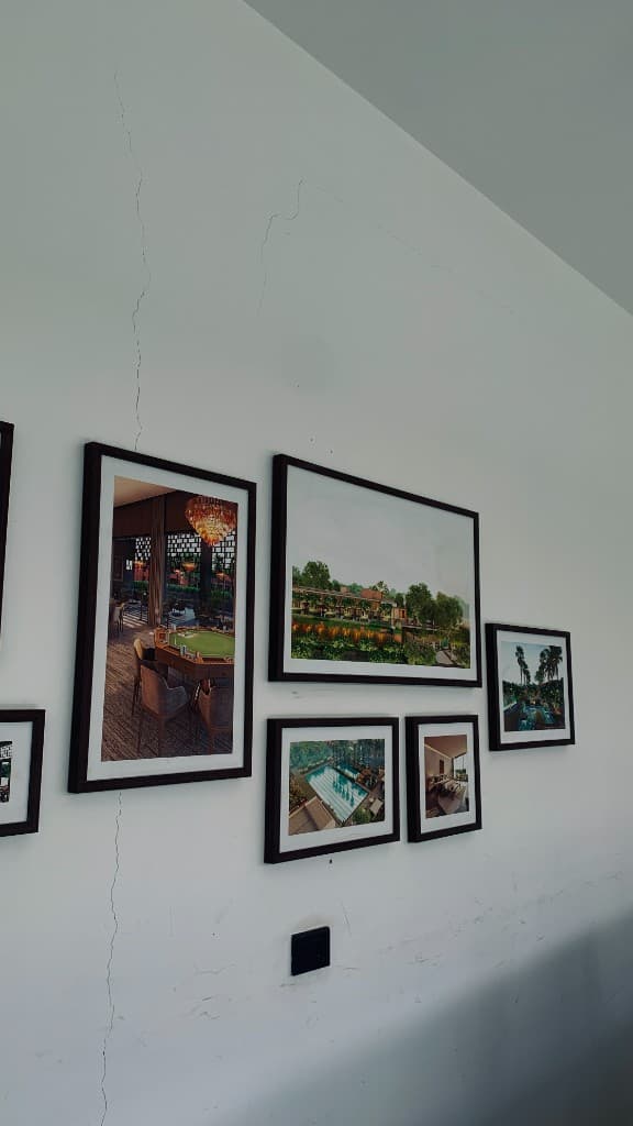 Architectural renderings on a gallery wall